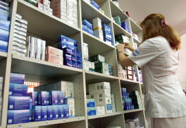 ARGENTINE WOMAN WORKS IN A DRUGSTORE IN BUENOS AIRES.